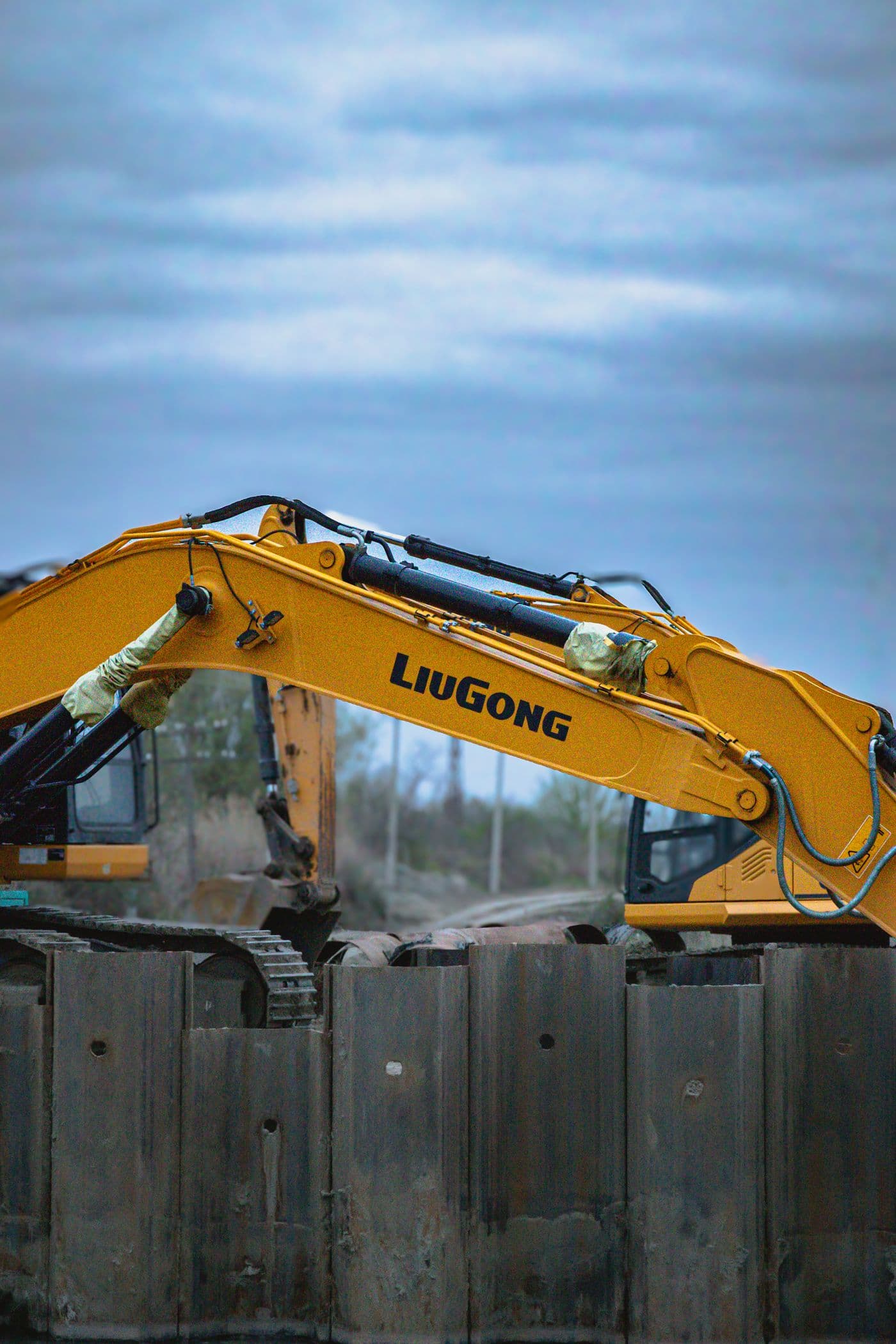 Close-up of a hydraulic excavator arm on site